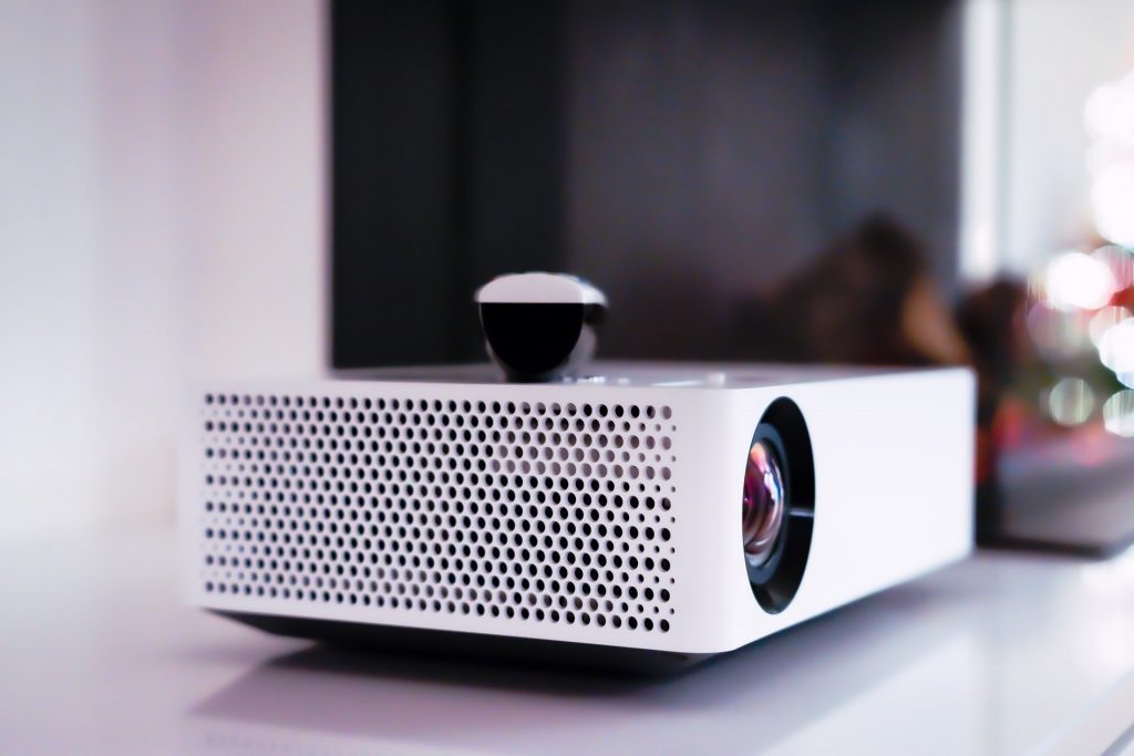 home projector sitting on top of a bench